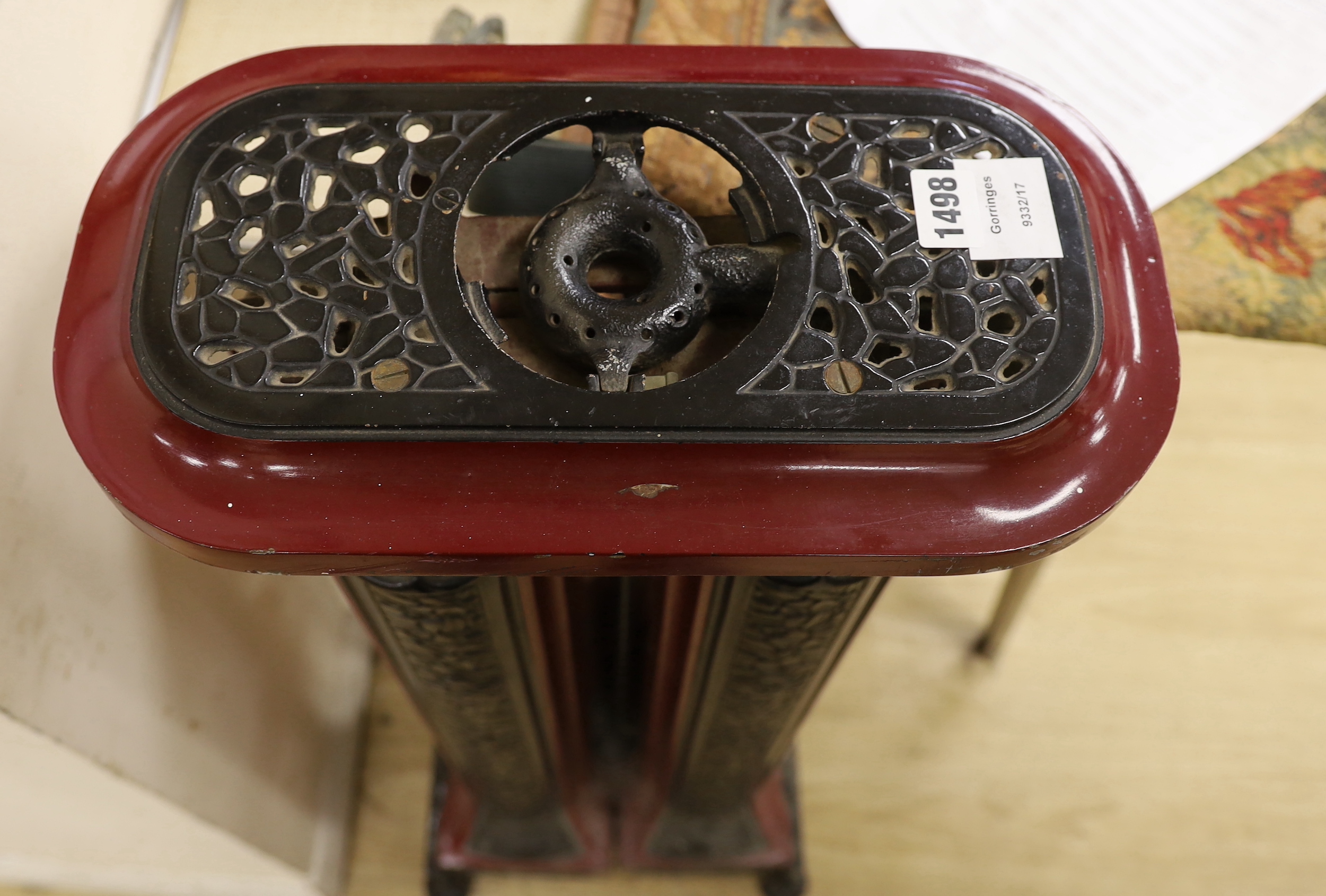 A maroon and black enamel Cannon Hilston heater, 95cm high, 39cm wide